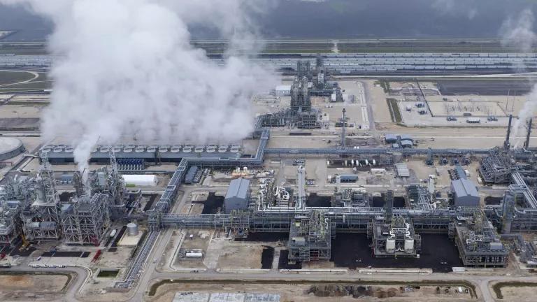 An aerial view of emissions rising from an ethane cracker plant at a petrochemical complex