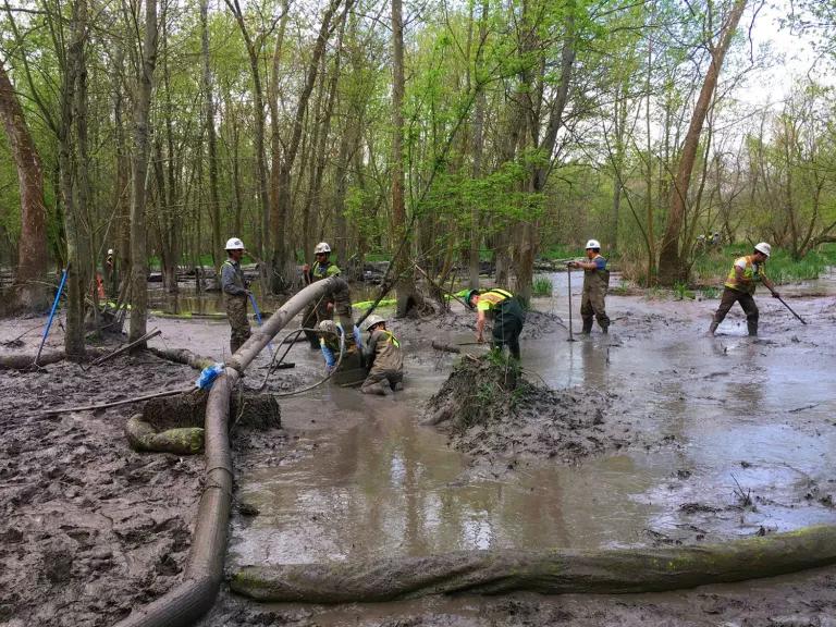 Cleanup workers at the wetland site of a drilling mud spill from a gas pipeline in Ohio