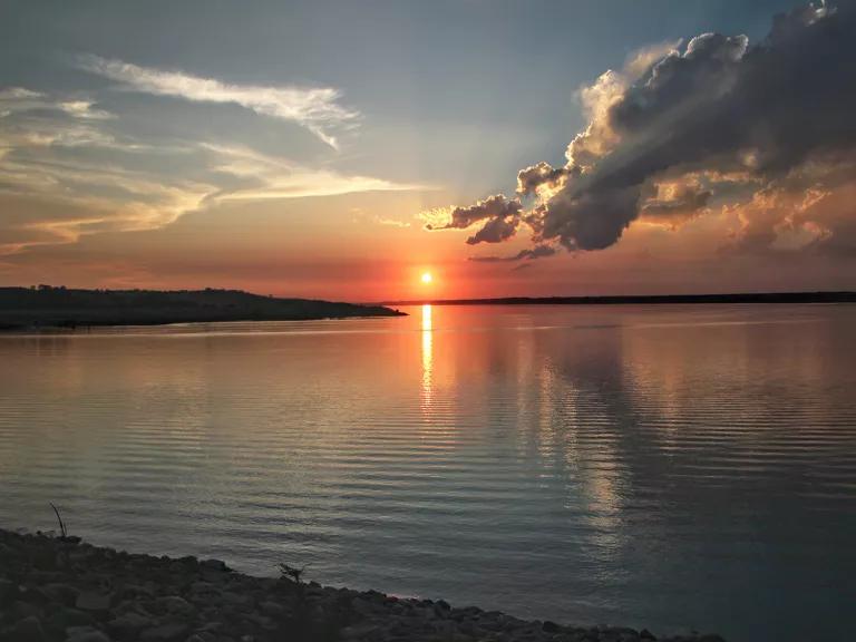 The sunset sky reflected on the waters of Lake Oahe