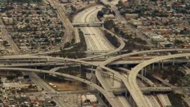 A major highway interchange divides several neighborhoods in Los Angeles