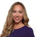 A headshot of Taryn Kiekow Heimer