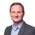A headshot of Timothy Edland