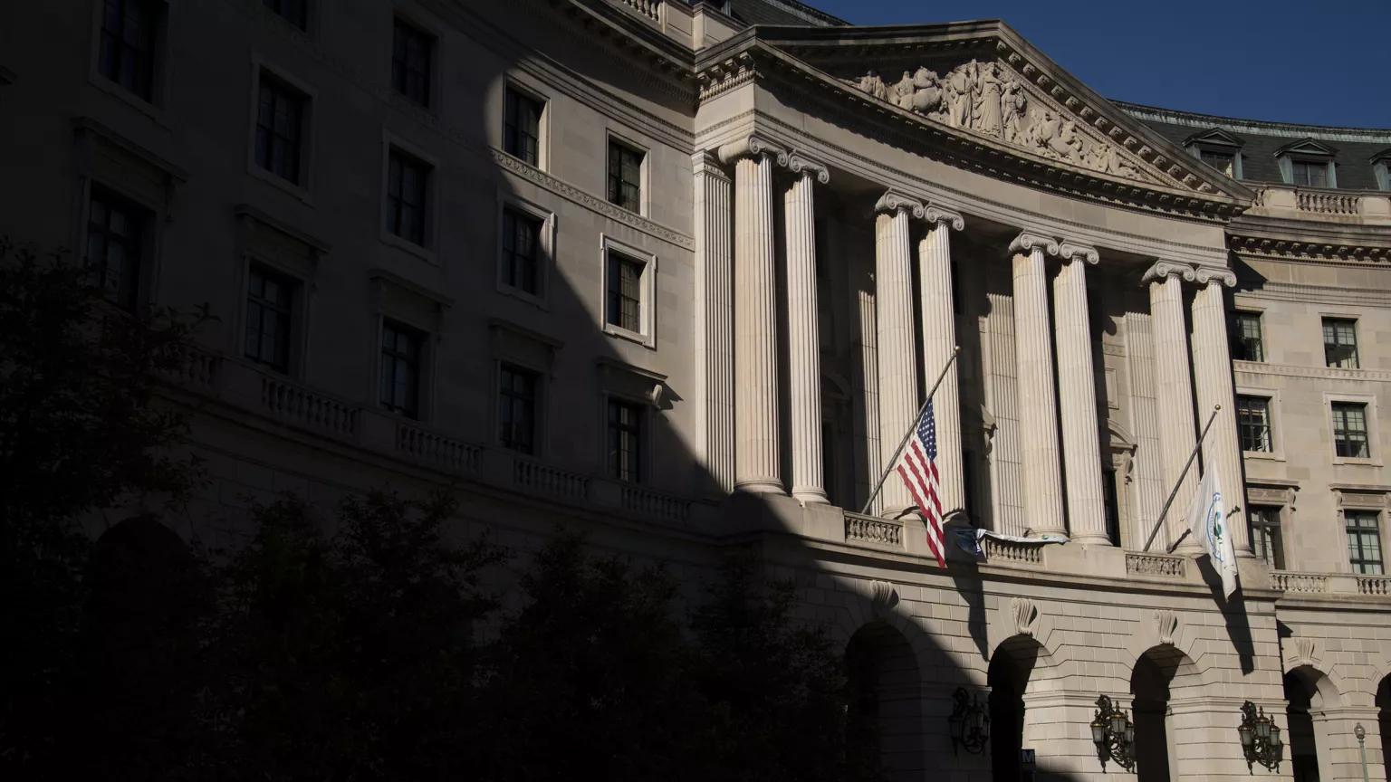 A dark shadow falls over half of the exterior of the U.S. Environmental Protection Agency Headquarters building on a sunny day