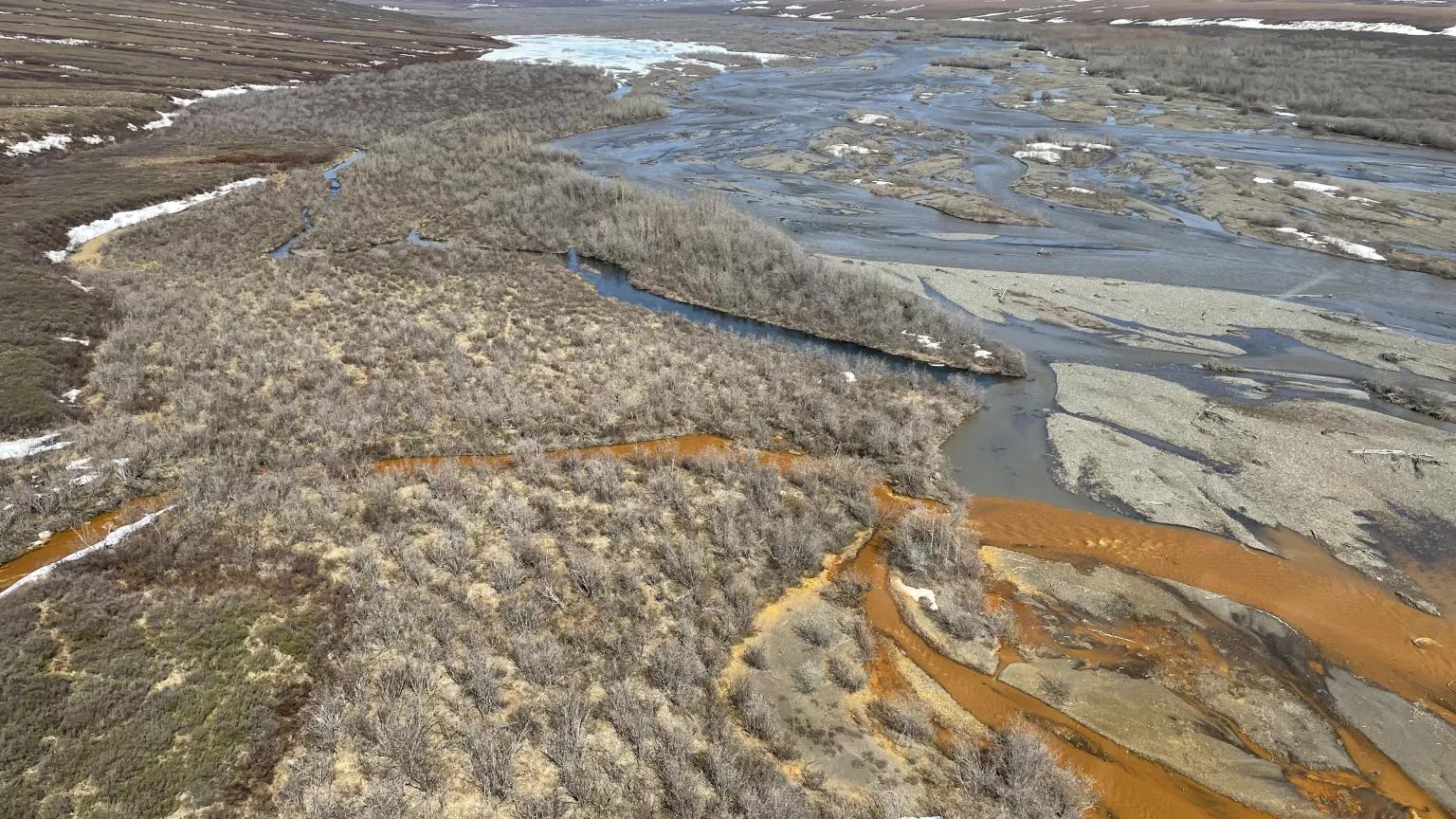 Orange streams are increasingly common in the Brooks Range of northern Alaska. The orange stream color reflects oxidized iron, but also often indicates elevated heavy metal concentrations. 

The USGS's ongoing study aims to document these occurrences and the timing of their onset. By sampling orange stream chemistry and assessing their spatial and temporal distribution USGS aims to 1) test multiple hypotheses related to their cause and link to warming and thawing landscapes, and 2) consider the implications