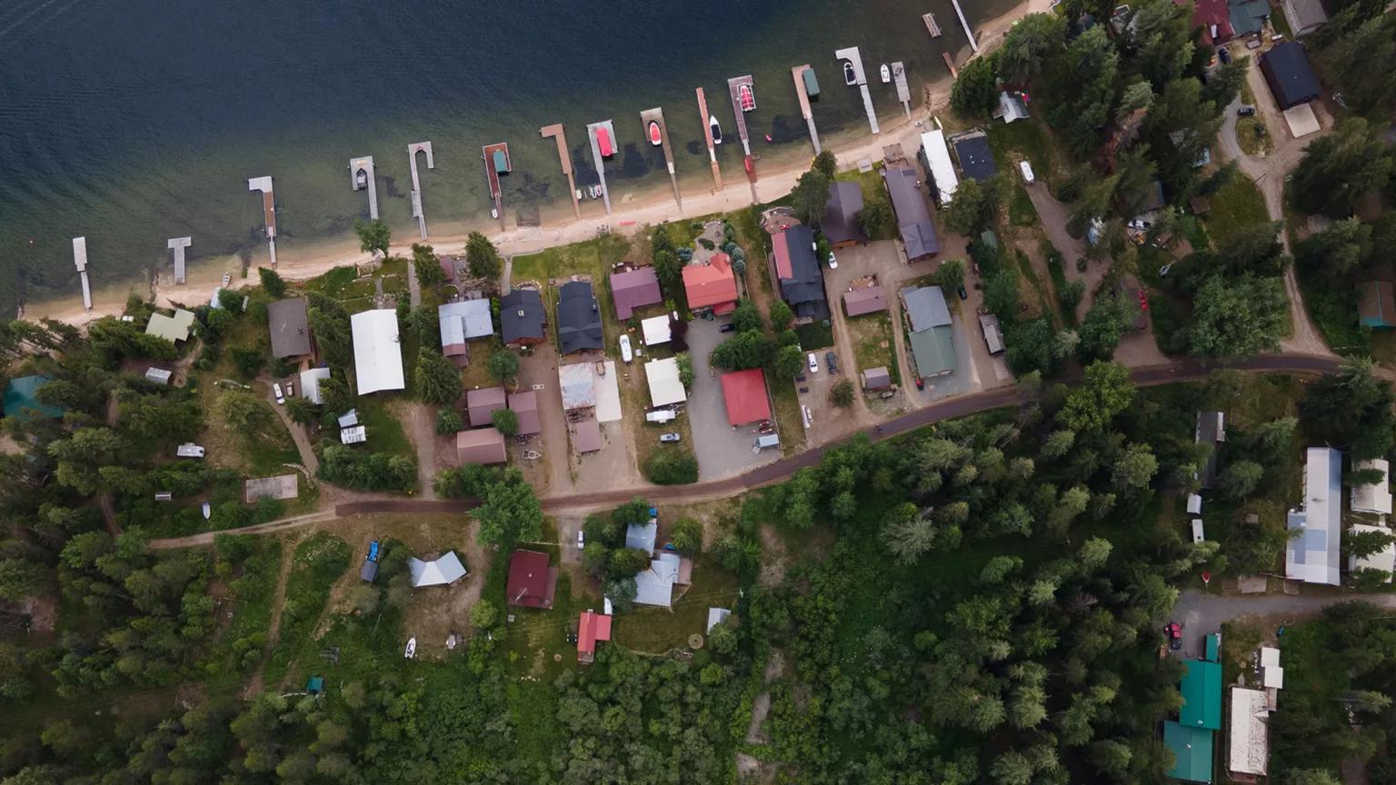 An aerial view of homes situated on a coastline