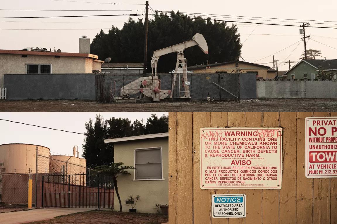 At top, a small oil pumpjack sits in front of a fence with three houses visible just on the other side of it; at bottom right, a sign posted on a wooden fence reads in part "Warning: This facility may contain one or more chemicals known to the sttae of California to cause cancer, birth defects, and reproductive harm; at bottom left, to large storage tanks are visible over the fence within feet of a residential home