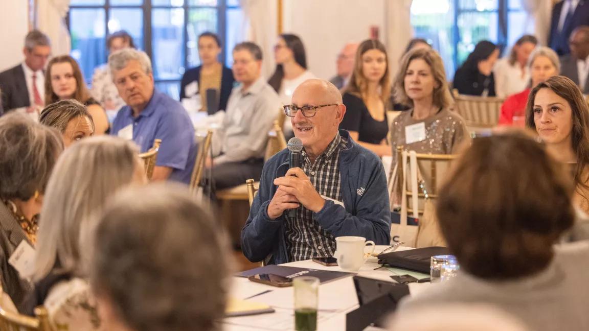 An attendee asks a question during the Green Leaders for Change (GLC) Summit held at the St. Regis in Washington, DC, on May 7, 2025.