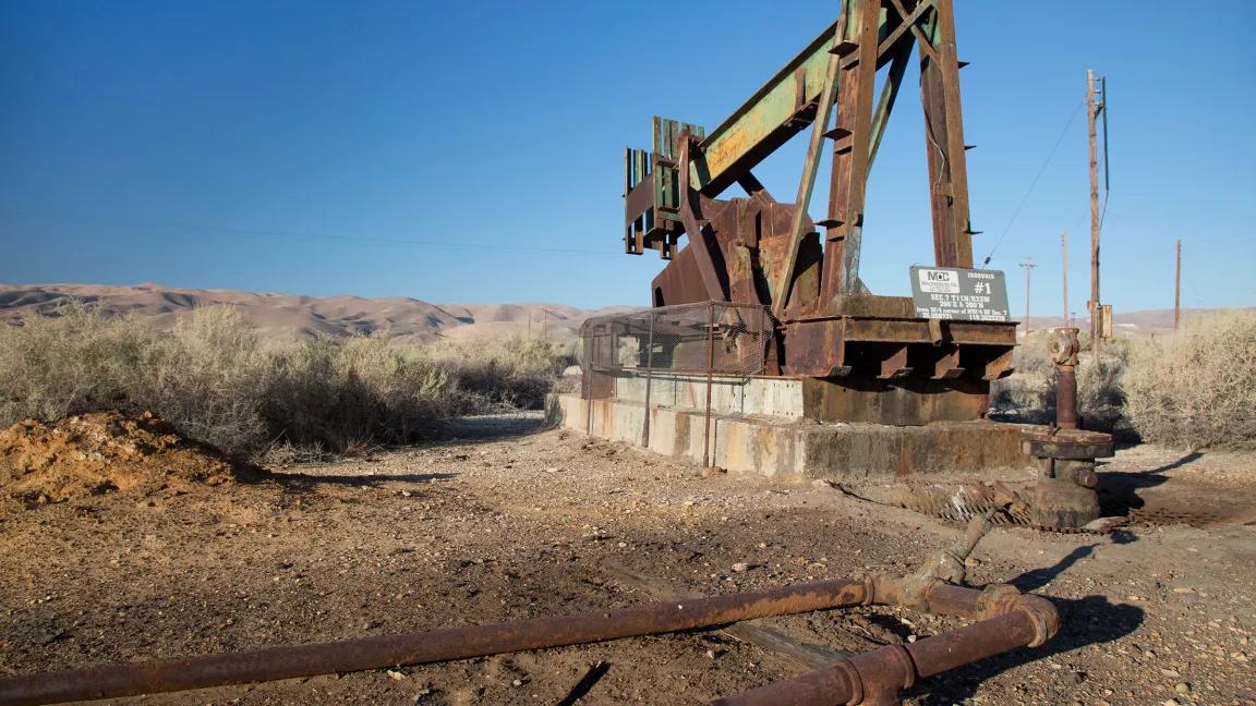A rusty pumpjack at an abandoned oil well in the southern San Joaquin Valley, Maricopa County, California