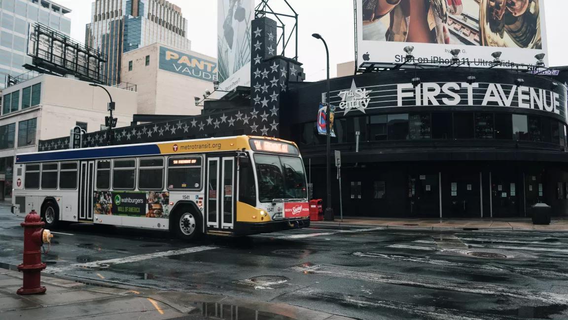 A bus drives through downtown Minneapolis