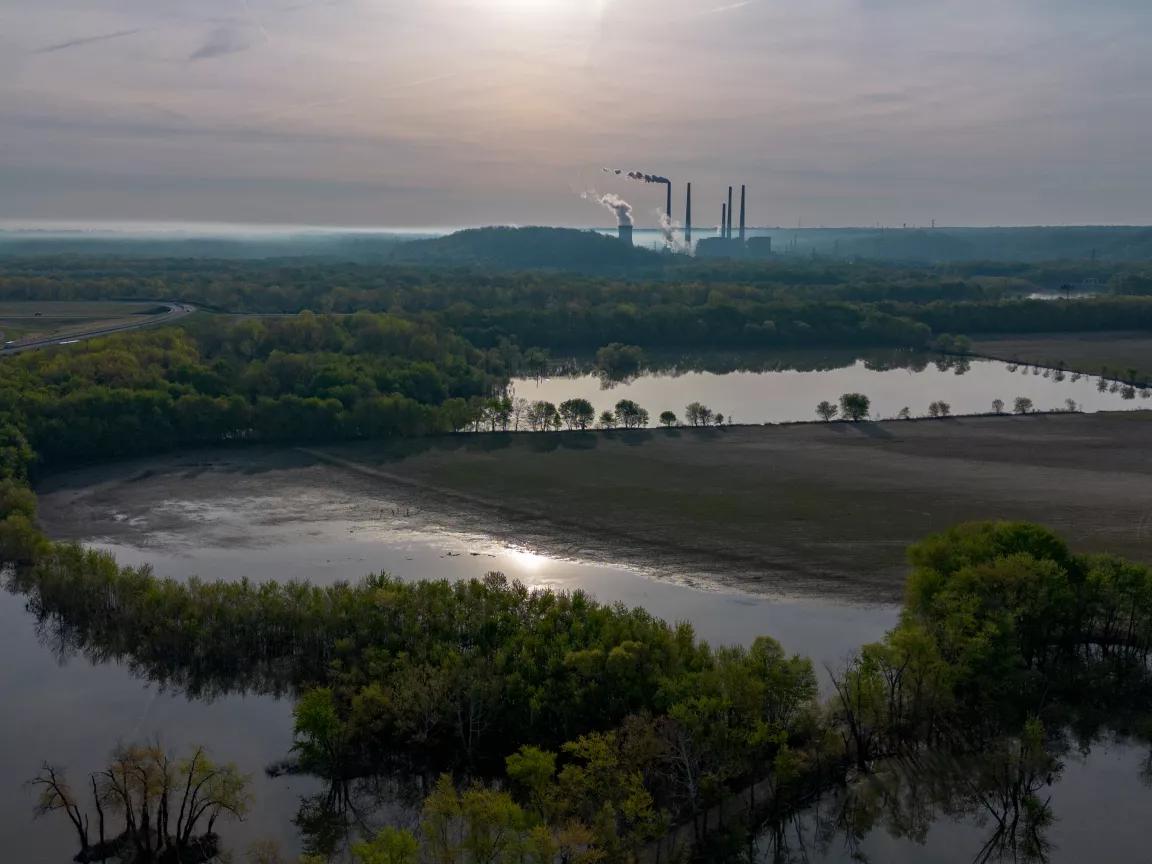 Pollution and steam rising from the coal-fired Miami Fort Power Station situated along the Ohio River near Cincinnati, Ohio, on April 12, 2026.