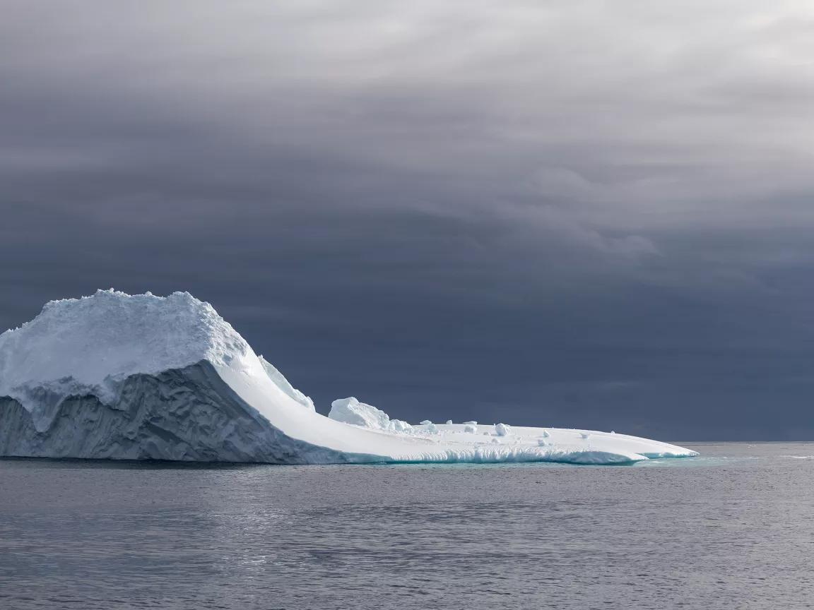 An iceberg surrounded by water