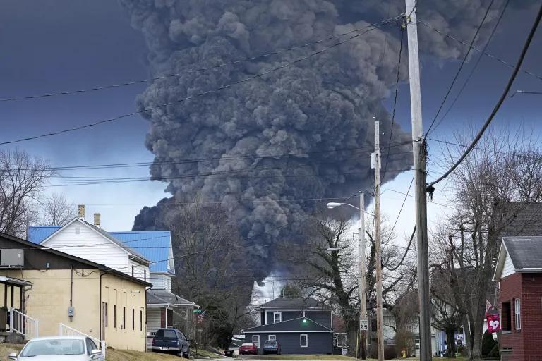 A mushroom cloud of smoke rises from the train derailment