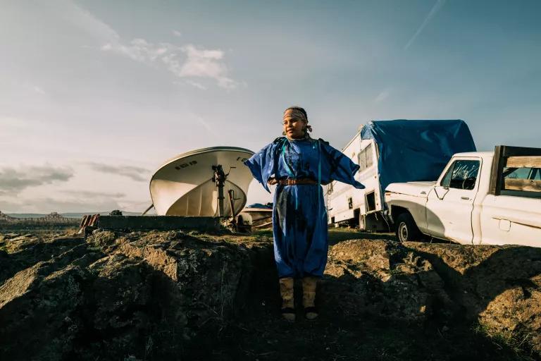A young girl stands at an "in lieu" site, which were created after the construction of dams flooded tribal villages and fishing sites and displaced citizens of the Columbia Basin's tribes.