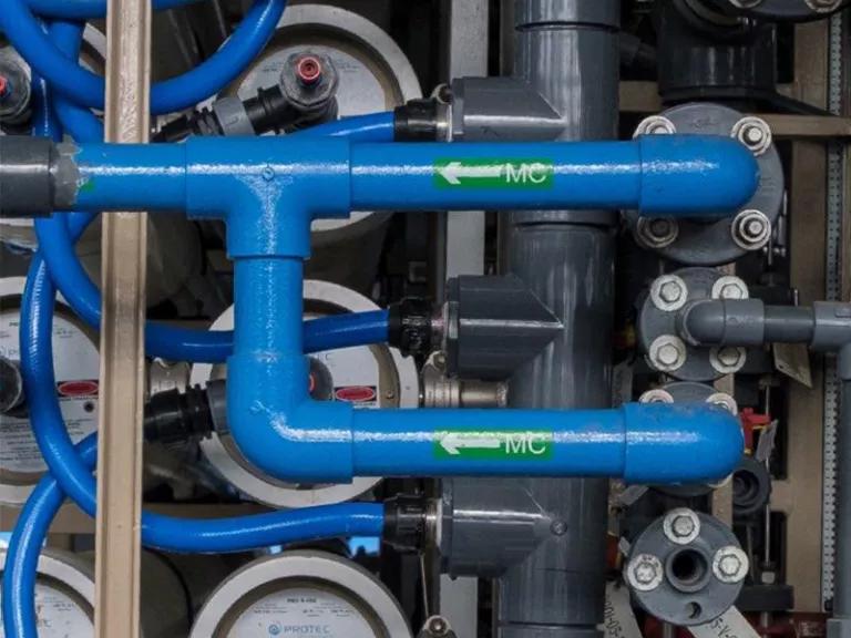 A close-up view of pipes at a water recycling plant