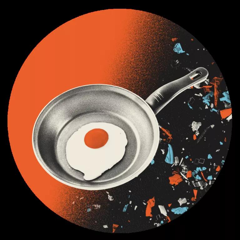An illustration of pan with an egg frying in it