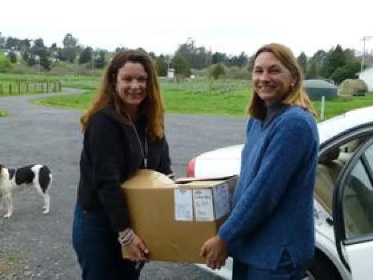 Camille Pope of FISH and Kristine Beck of Twisted Horn Ranch do their part to get food to hungry people! (Credit-T.jpg