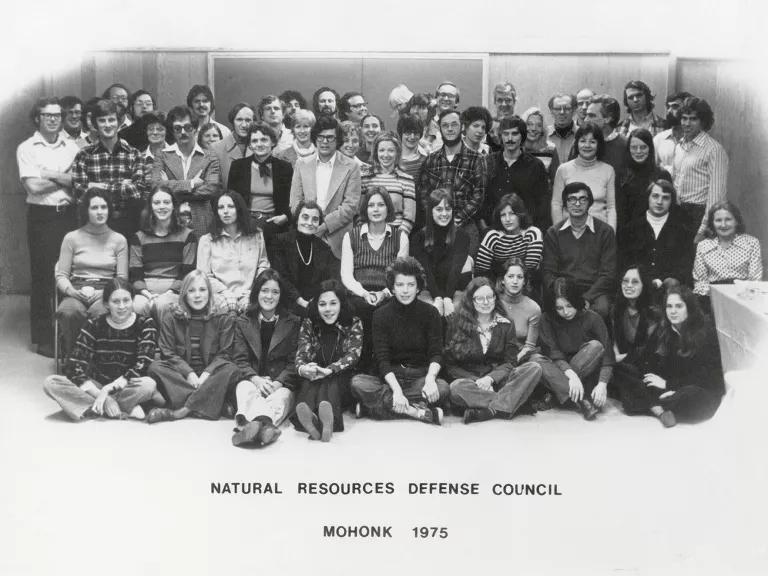 A black and white image of a group of NRDC employees from 1975