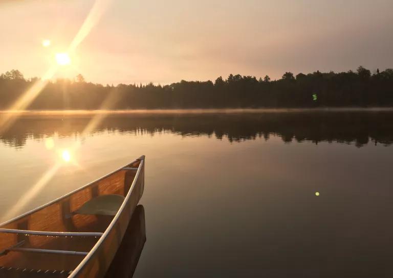 Canoe on the Boundary Waters in a Foggy Sunrise