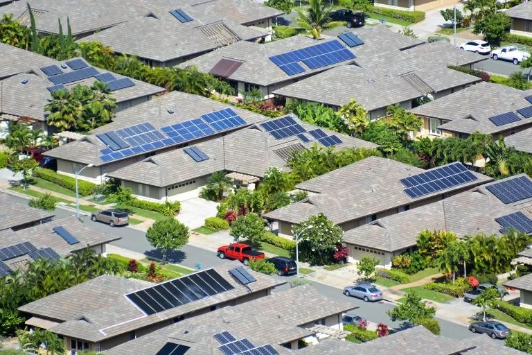 Aerial image of a neighborhood with rooftop solar panels