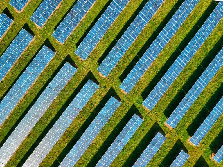 Aerial image of solar panels in a field