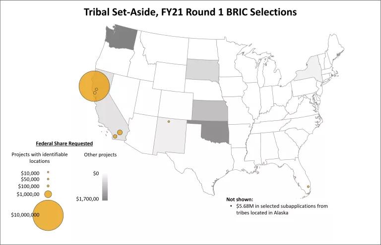 Map of the contiguous United States titled “Tribal Set-Aside, FY21 Round 1 BRIC Selections.” Yellow dots and gray shading show projects in AK, CA (including one very large project), FL, KS, NM, NY, OK, SD, and WA. 