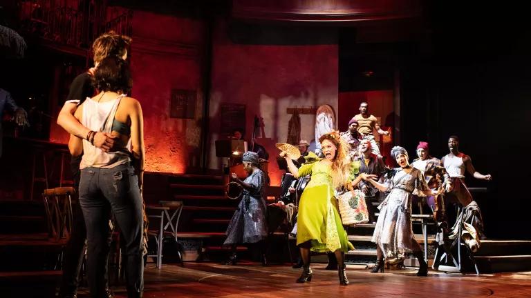 Performers dance on-stage