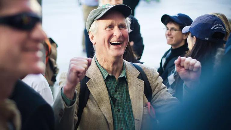 NRDC founding director, former president, and honorary trustee John Adams cheering with a fist pump during a protest in opposition to TransCanada's Keystone XL pipeline outside the White House in Washington, D.C.