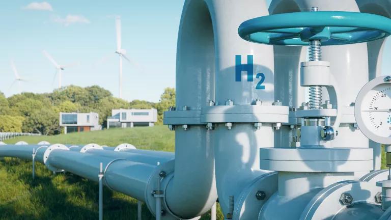 A hydrogen transport pipe running across a grassy field