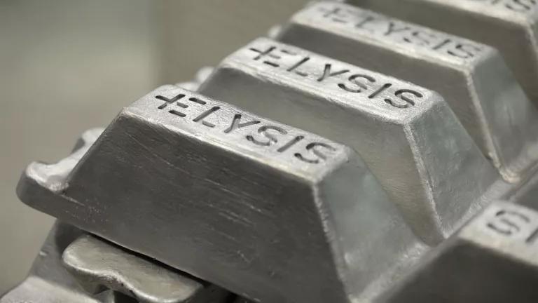 A close-up view of stacked ingots of Elysis aluminum.