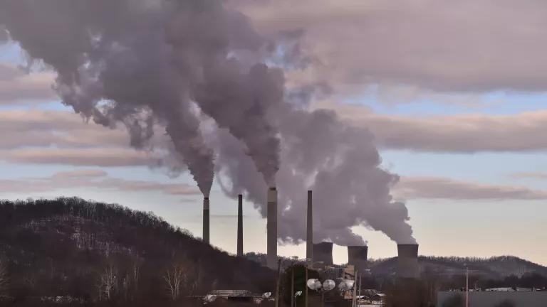 Clouds of emissions rising from the smokestacks of a coal-fired power plant