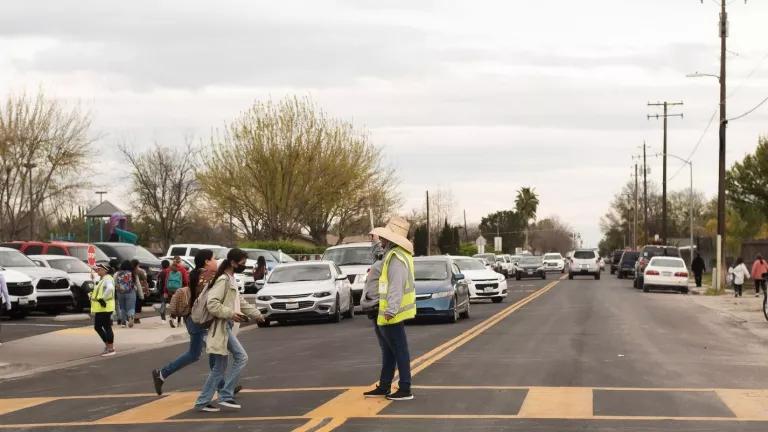 Children cross the street in Corcoran, California.