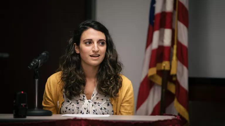 Gabrielle Habeeb speaking at a public hearing in Chicago, Illinois