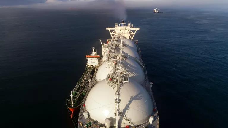 A wide angle aerial view of a liquefied natural gas tanker ship in the Sea of Japan