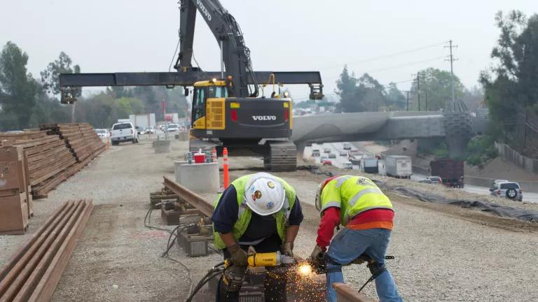 A crew working on the Los Angeles Metro Gold Line Foothill Extension in California, February 2014.

The extension will continue the Metro Gold Line light rail line from East Pasadena to Montclair.