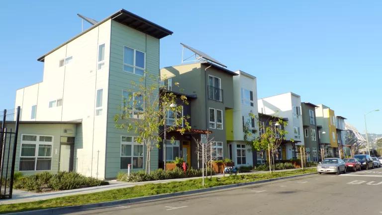 A street front view of newly built affordable homes in Oakland, California