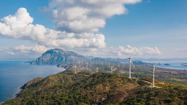 Wind turbines on a mountaintop in the Datça Peninsula, Türkiye.
