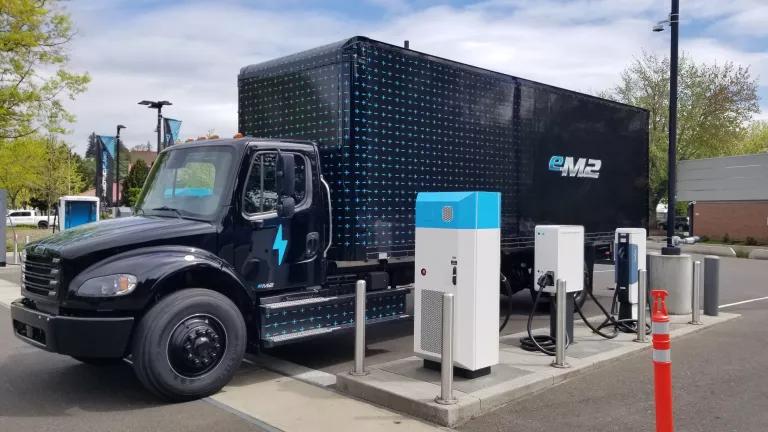 An electric semi-trailer truck parked at "Electric Island", a charging site designed for heavy-duty trucks in Portland, Oregon.