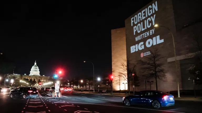 On the evening before President Donald Trump was set to meet with U.S. oil executives to discuss Venezuela, activists staged a large-scale projection opposing oil-driven intervention and the use of U.S. taxpayer dollars to subsidize Big Oil in Washington DC, on January 8, 2026.