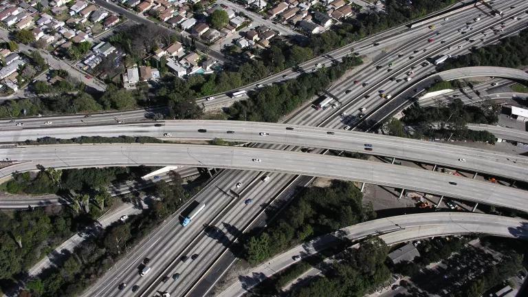 Traffic crossing a freeway interchange near a residential neighborhood in Los Angeles, California.