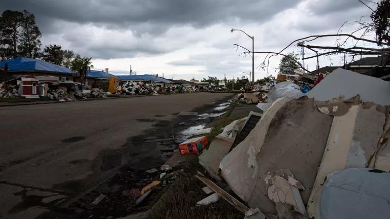 A street lined with piles of debris following Hurricane Ida in LaPlace, St. John the Baptist Parish, Louisiana, on October 1, 2021.