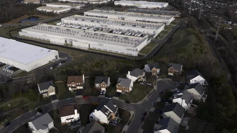 Amazon data center located beside a residential neighborhood in Sterling, VA on March 14, 2026. Data centers require large amounts of natural resources, including water, to run. Northern Virginia has the largest concentration of data centers in the world, managing roughly 70% of global internet traffic.