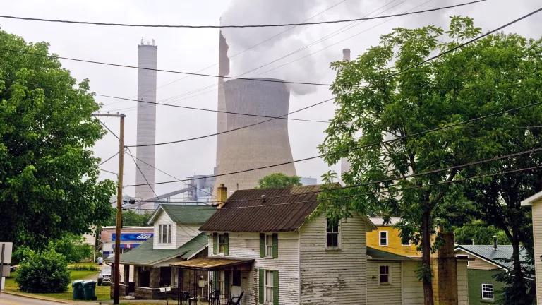 Emissions rising from a coal-fired power plant near homes in a residential neighborhood, 2007.