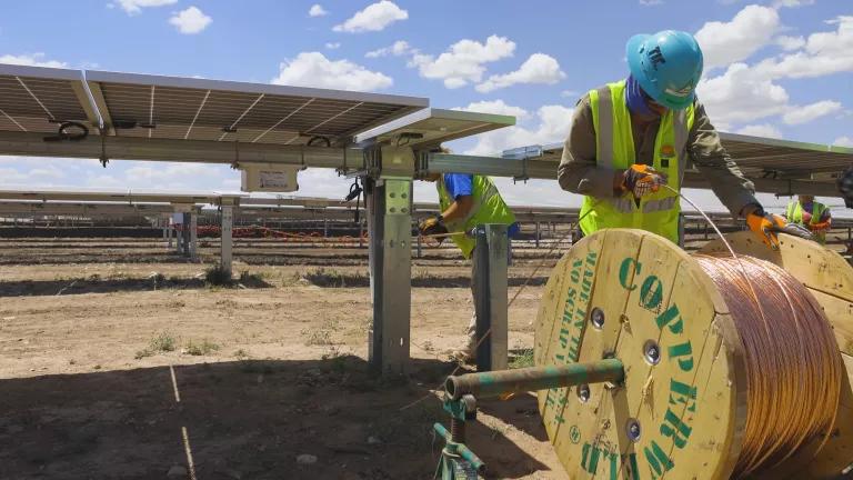 Engineers installing cable at a utility scale solar farm under construction in Arizona on May 23, 2025.