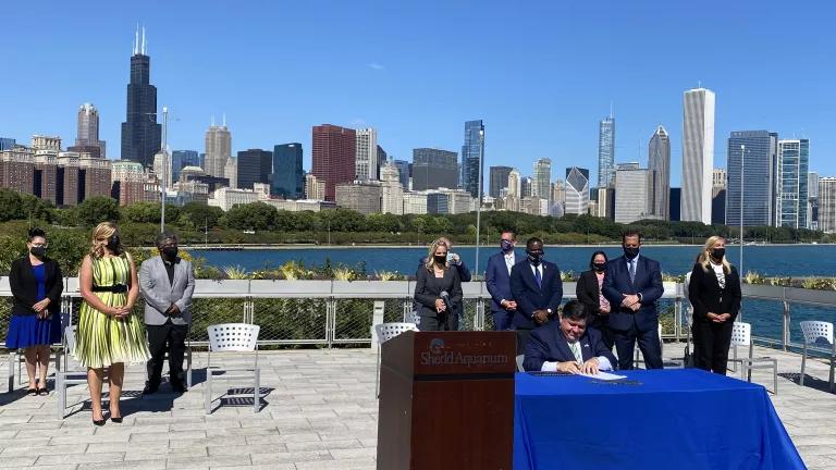 Illinois Governor JB Pritzker signing the Climate and Equitable Jobs Act
