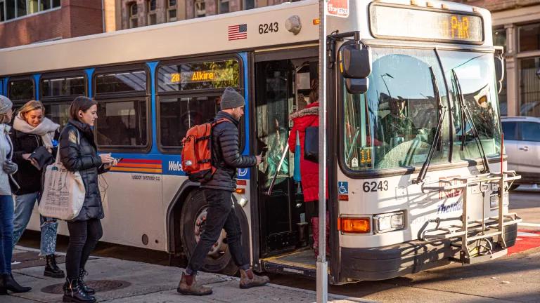 A man boards a bus in Denver, Colorado