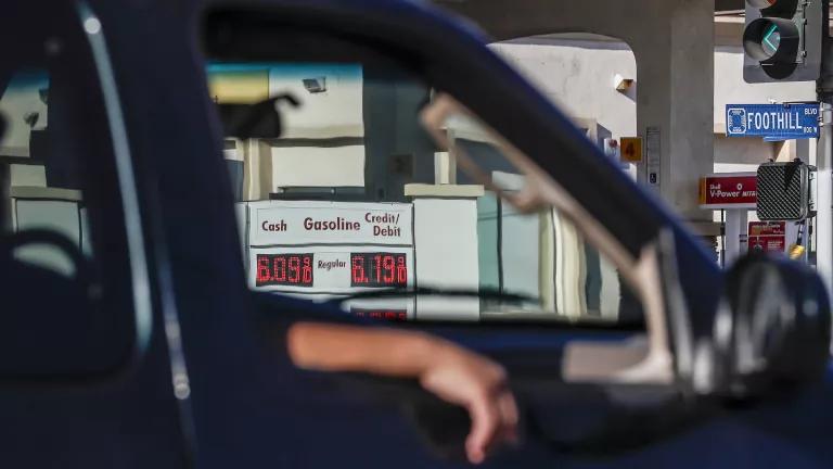 Drivers pass a gas station in Azusa, California