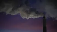 Exhaust blows out of flue-gas stacks at Mill Creek Generating Station, a coal-fired power plant outside of Louisville, Kentucky, on February 14, 2026.