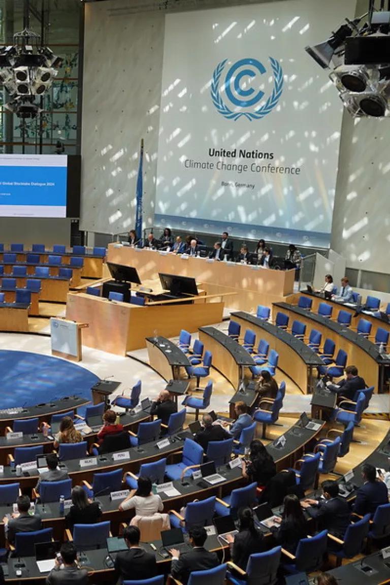 A group of people in a formal conference room