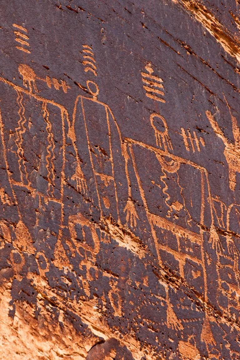 A close-up of ancient petroglyphs on a cliff