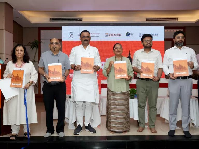 Representatives from NRDC India, Mahila Housing Trust (MHT), Indian Institute of Public Health, Gandhinagar (IIPHG), Nagar Nigam Varanasi (VNN), and Shri Kashi Vishwanath Temple Trust, at the launch of the Varanasi Heat Action Plan (HAP) in Varanasi, Uttar Pradesh, India, on May 16, 2025.

People included:
Director of NRDC India Dipa Singh Bagai (center)